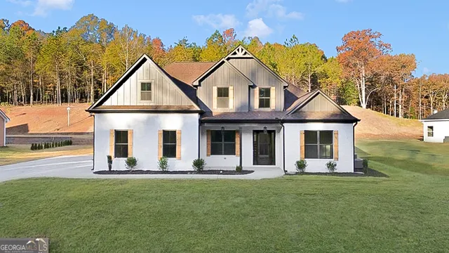 a front view of a house with a yard