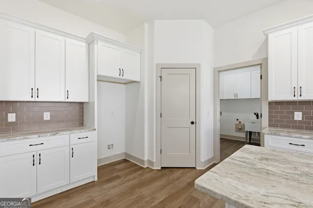 a kitchen with a sink and cabinets