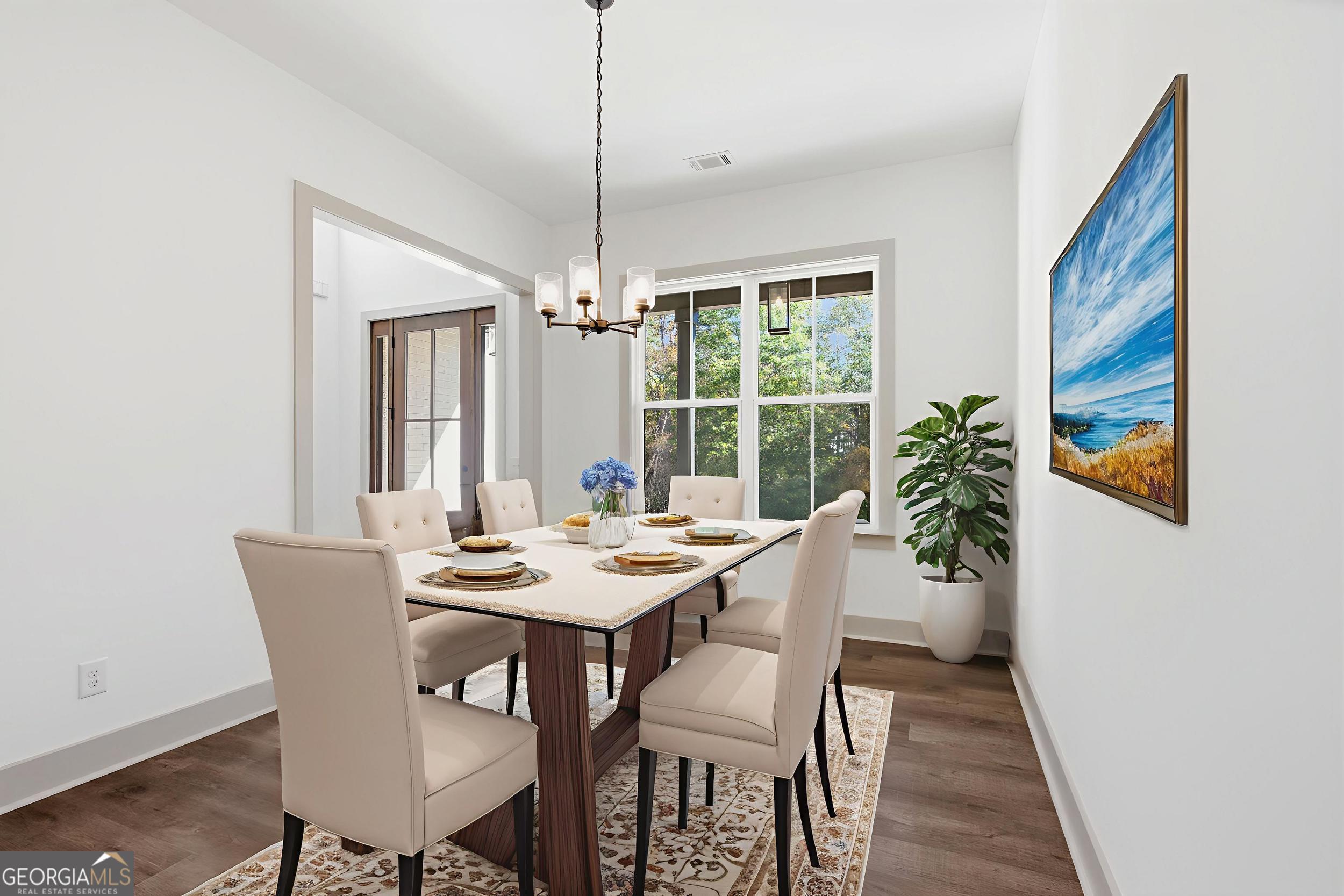 297 Ayers Creek Drive Toccoa, GA 30577 - Photo 15 of 51 a view of a dining room with furniture window and wooden floor