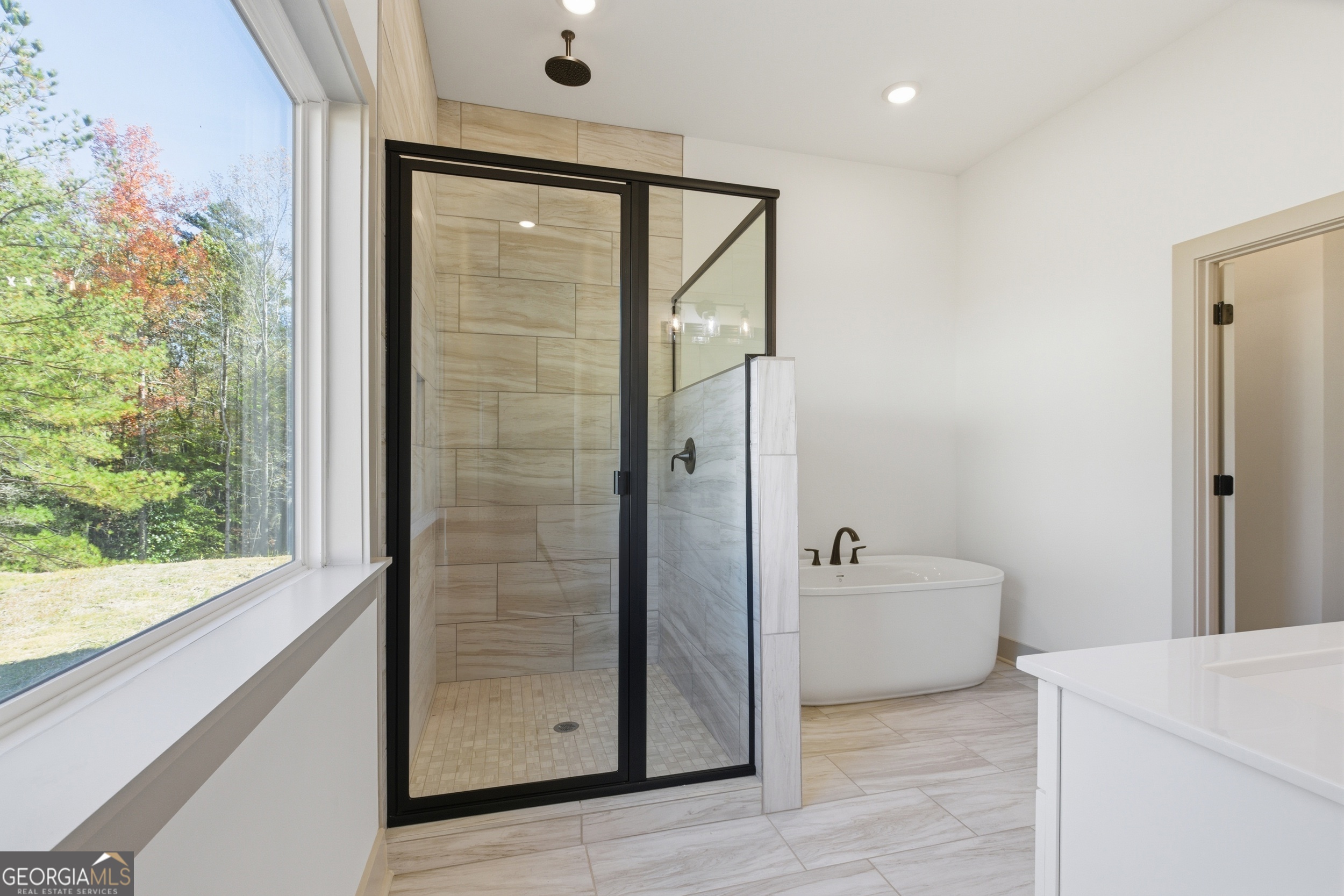 297 Ayers Creek Drive Toccoa, GA 30577 - Photo 21 of 51 a bathroom with a bathtub and a shower