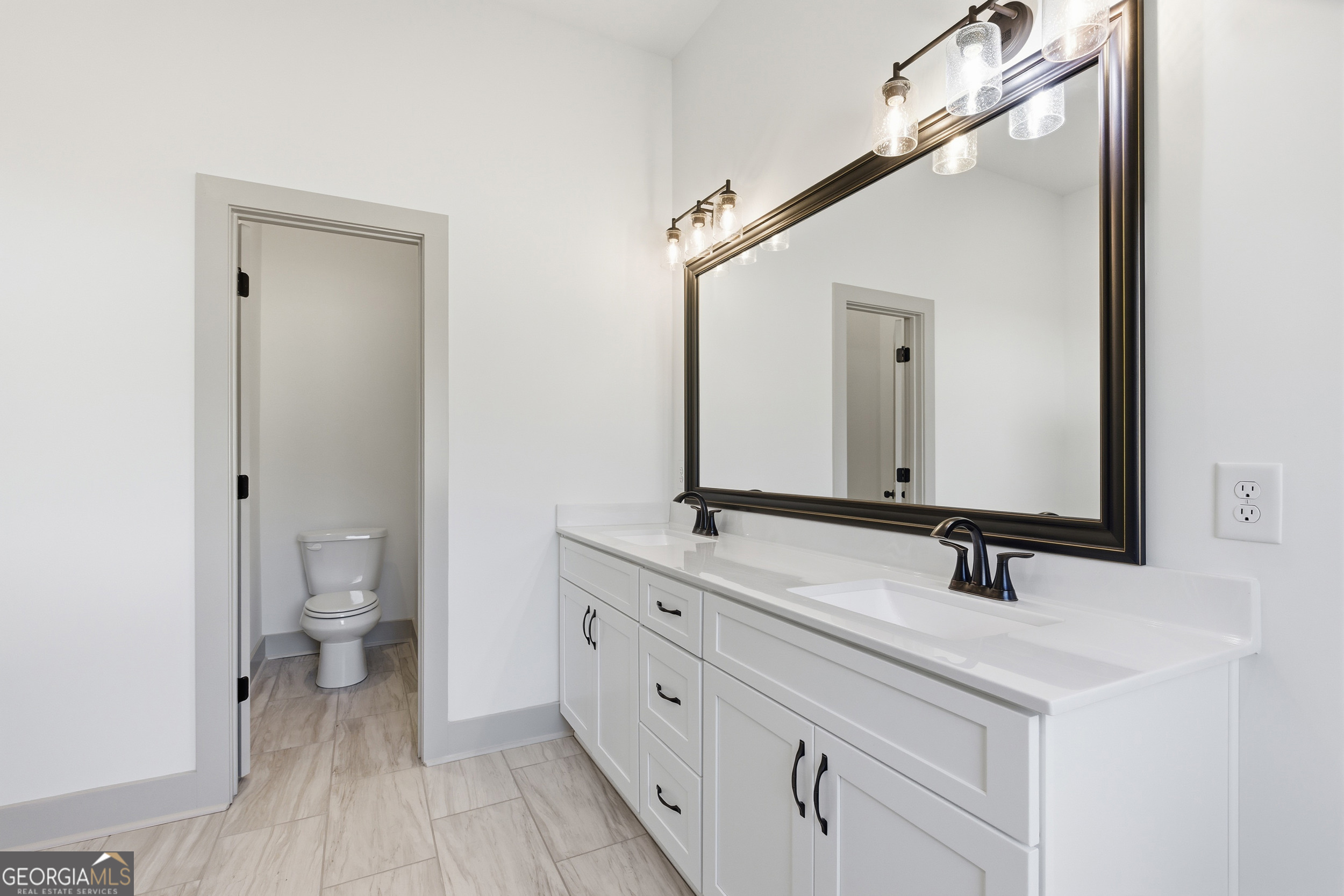 297 Ayers Creek Drive Toccoa, GA 30577 - Photo 23 of 51 a bathroom with a double vanity sink and a mirror