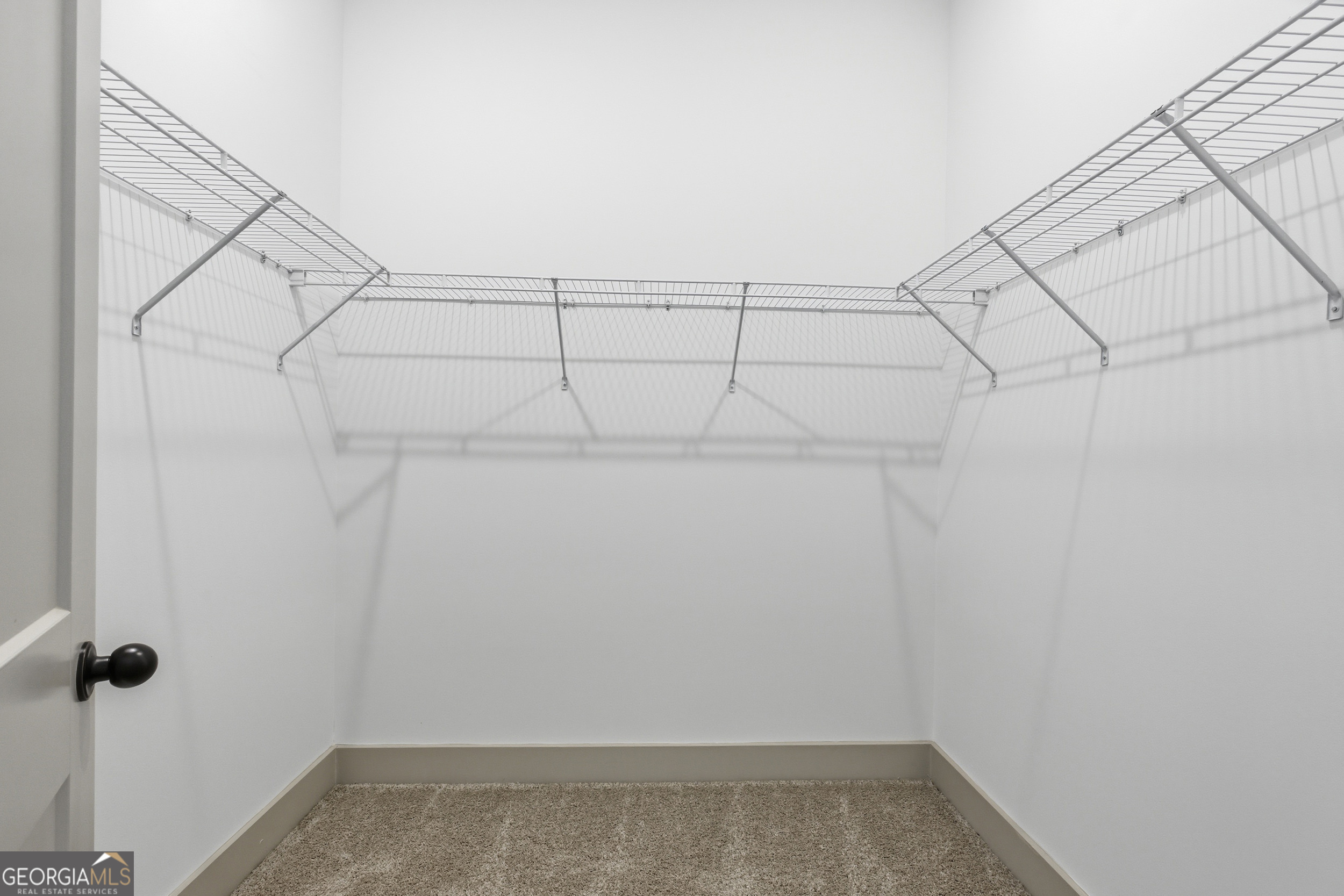 297 Ayers Creek Drive Toccoa, GA 30577 - Photo 25 of 51 a view of a room with racks on the wall