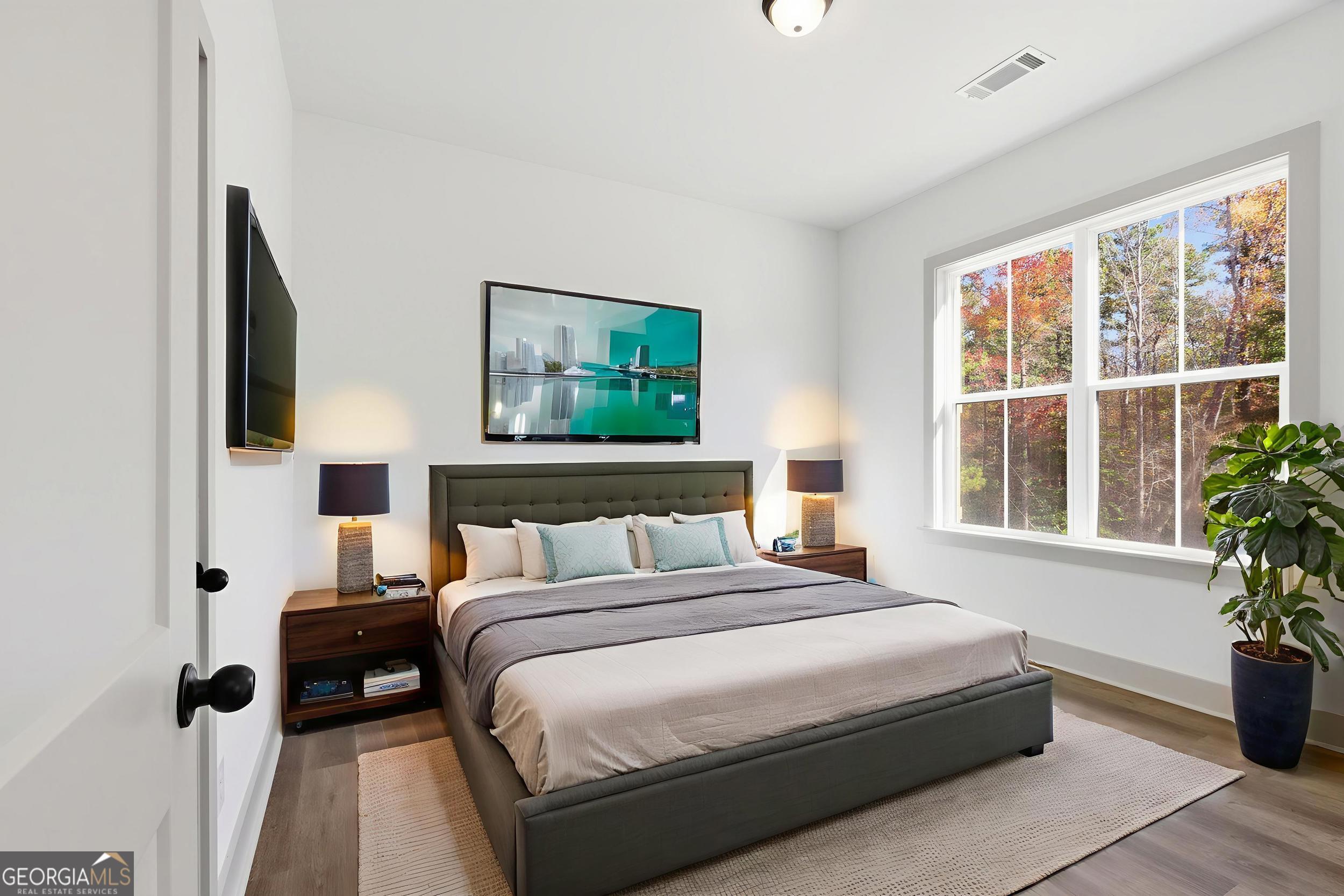 297 Ayers Creek Drive Toccoa, GA 30577 - Photo 26 of 51 a bedroom with a bed and glass window