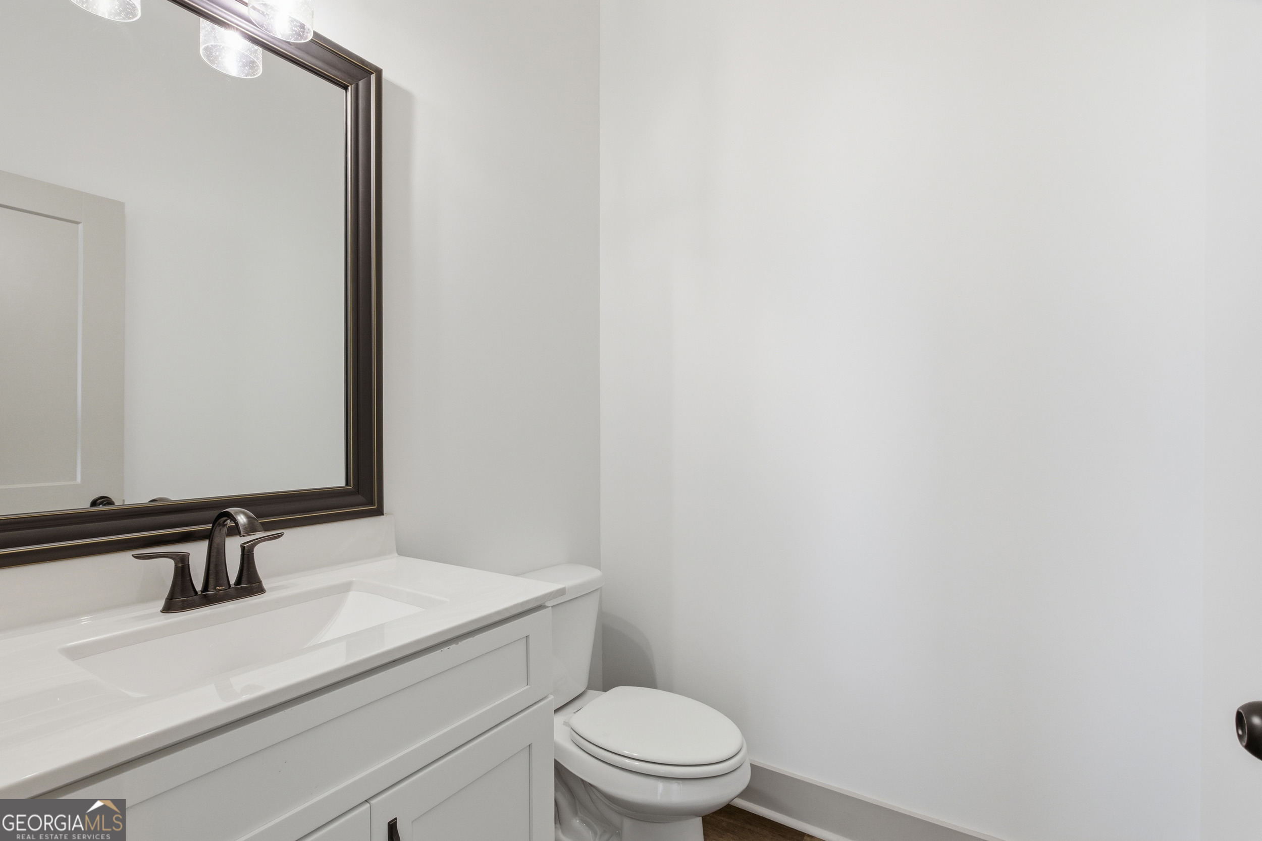 297 Ayers Creek Drive Toccoa, GA 30577 - Photo 29 of 51 a bathroom with a sink a toilet and mirror
