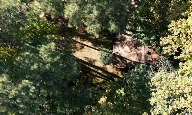 a backyard of a house with yard and outdoor seating