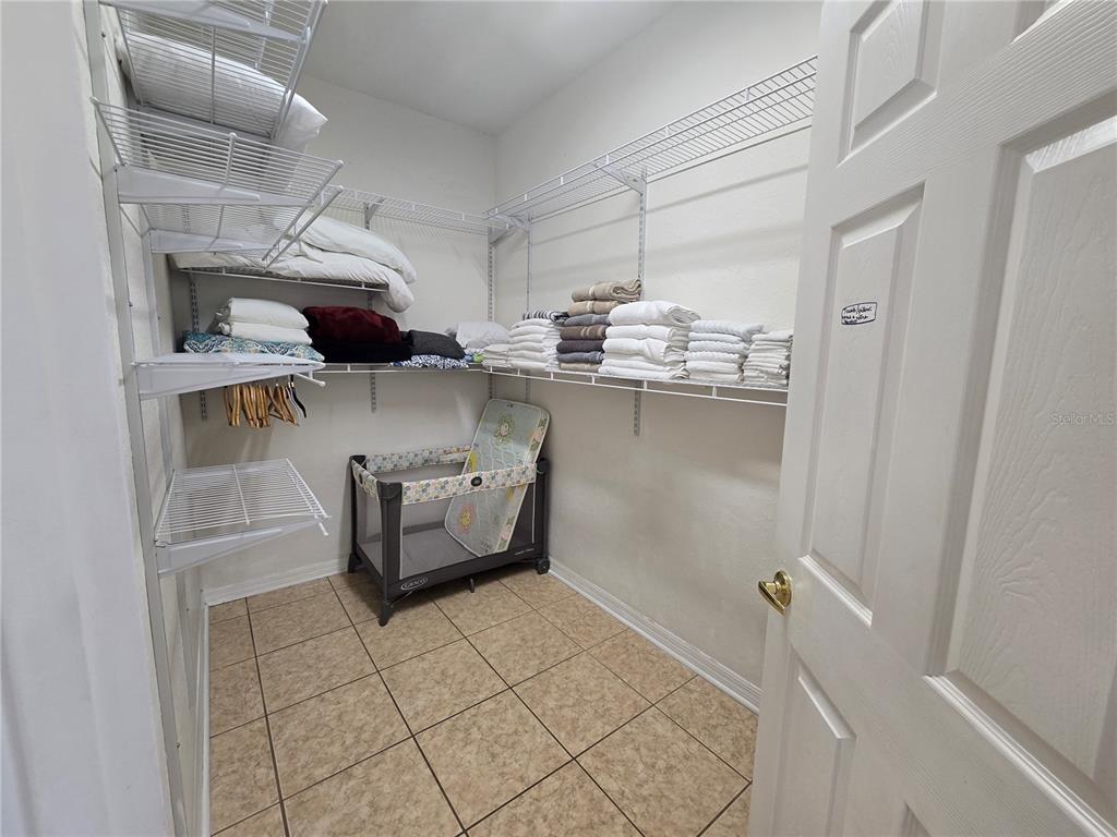 219 Cloverdale Road Winter Haven, FL 33884 - Photo 23 of 29 a kitchen with stainless steel appliances cabinets and a wooden floor