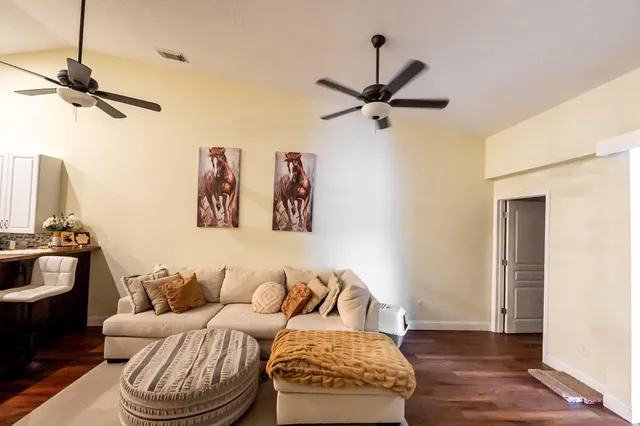 an aerial view of a house with garden space and lake view