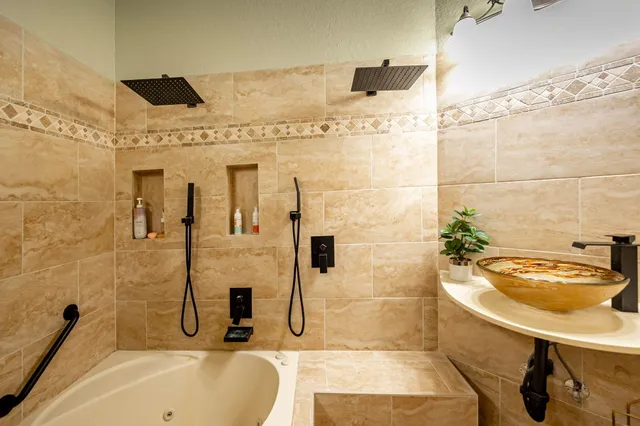 an aerial view of a house with garden space and lake view