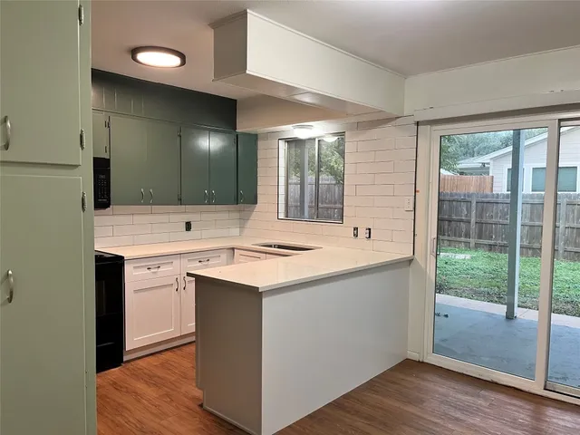 a view of bathroom with a sink and mirror