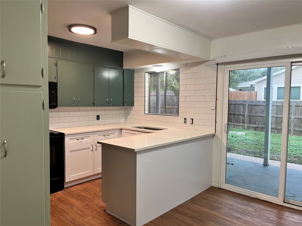 a view of bathroom with a sink and mirror