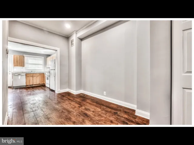 a view of kitchen with wooden floor