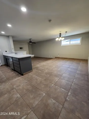 a view of a big room with windows and cabinet