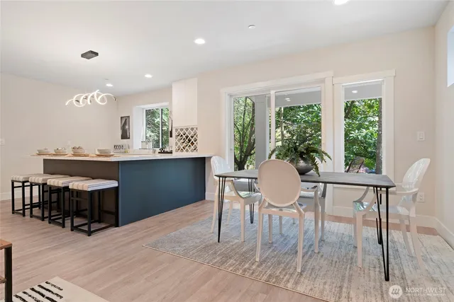 a living room with furniture a rug and a fireplace
