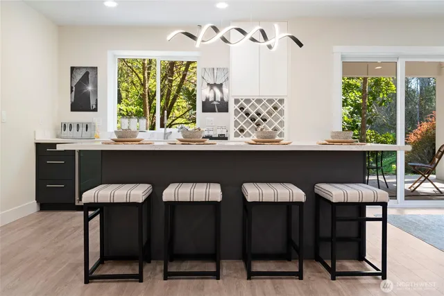 a bedroom with a bed a window and couch