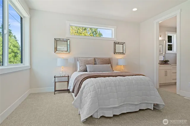 a living room with furniture a window and a potted plant