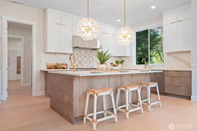 a dining room with furniture a chandelier and window