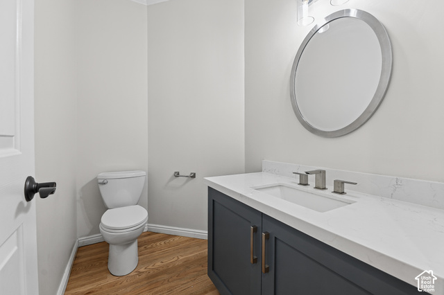 10664 Trail Ridge Circle Sandy, UT 84092 - Photo 21 of 113 Modern vanity with a light-colored countertop, undermount sink, and wood-finish flooring