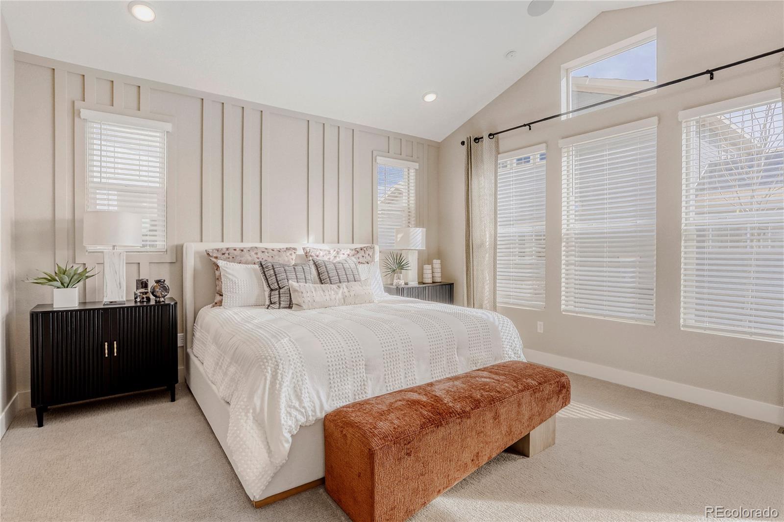 5386 Starling Way Firestone, CO 80504 - Photo 15 of 28 a bedroom with a bed and a couch