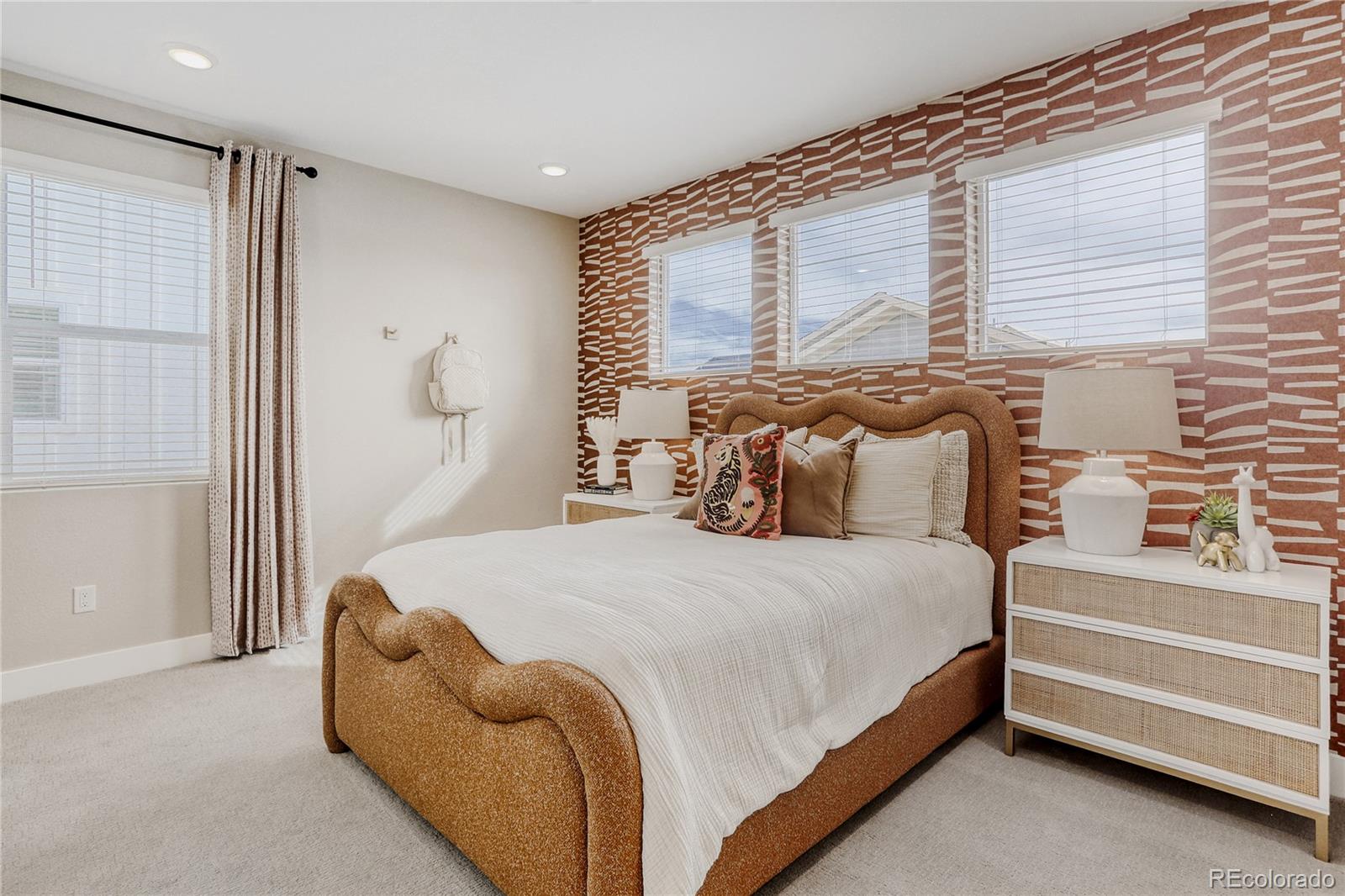 5386 Starling Way Firestone, CO 80504 - Photo 25 of 28 a bedroom with a bed and a cabinets