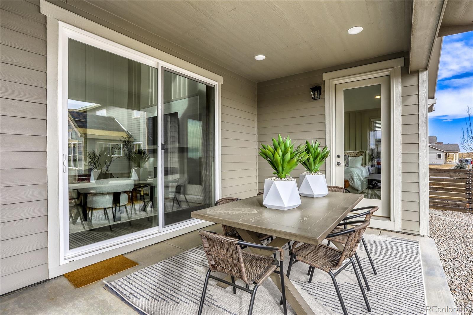 5386 Starling Way Firestone, CO 80504 - Photo 27 of 28 a view of a dining room with a table and chairs
