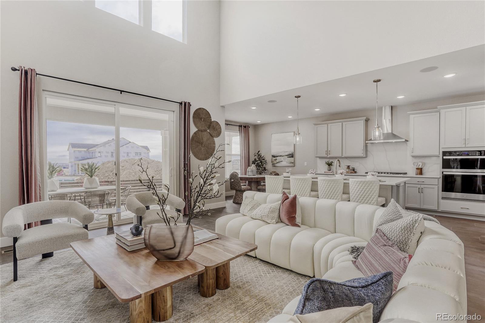 5386 Starling Way Firestone, CO 80504 - Photo 8 of 28 a living room with furniture and a large window