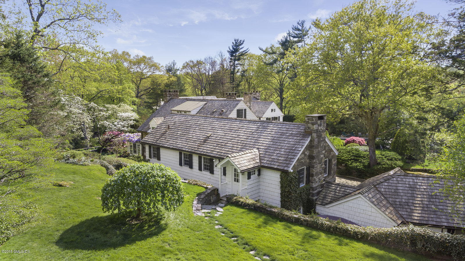 32 Pecksland Road Greenwich, CT 06831 - Photo 15 of 24 aerial view of a house with a yard table and chairs