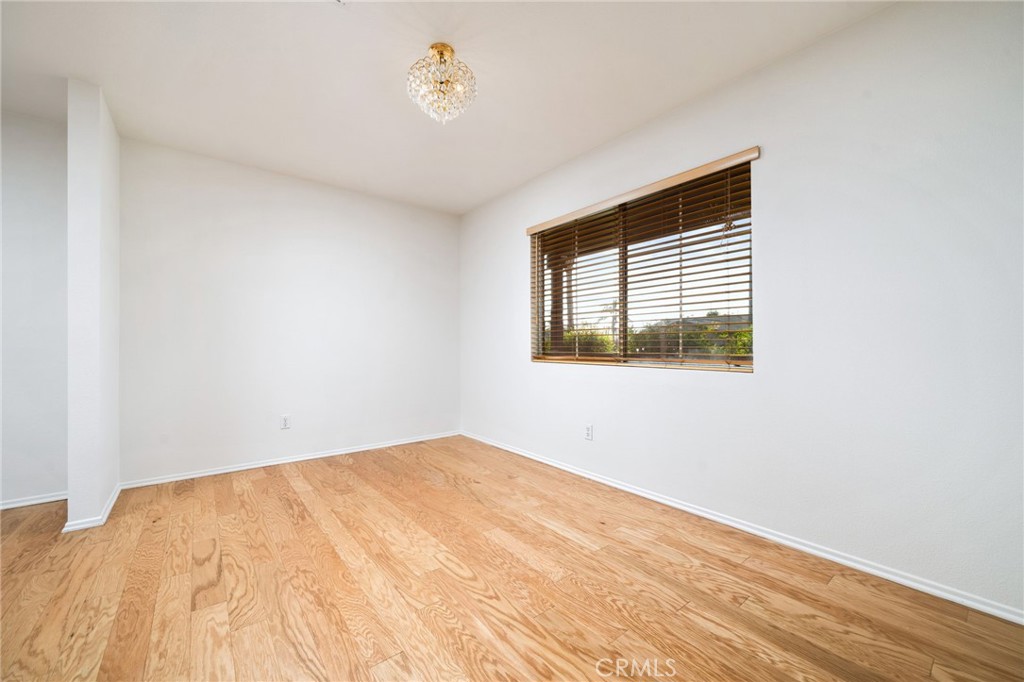 6361 Pintail Way Fontana, CA 92336 - Photo 12 of 32 a view of empty room with wooden floor and fan