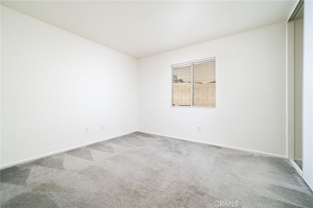 6361 Pintail Way Fontana, CA 92336 - Photo 13 of 32 an empty room with a window