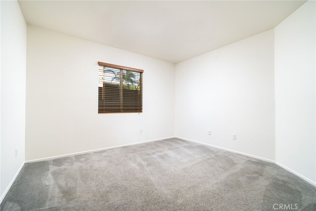 6361 Pintail Way Fontana, CA 92336 - Photo 15 of 32 an empty room with a window