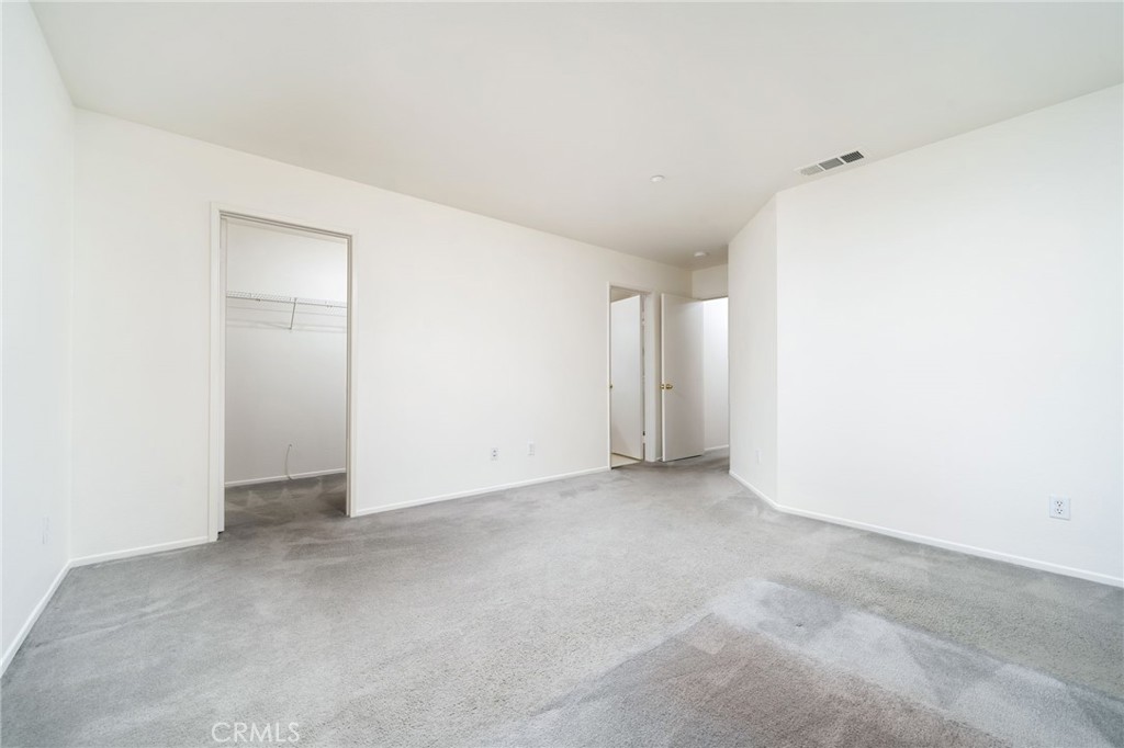 6361 Pintail Way Fontana, CA 92336 - Photo 17 of 32 an empty room with an entryway