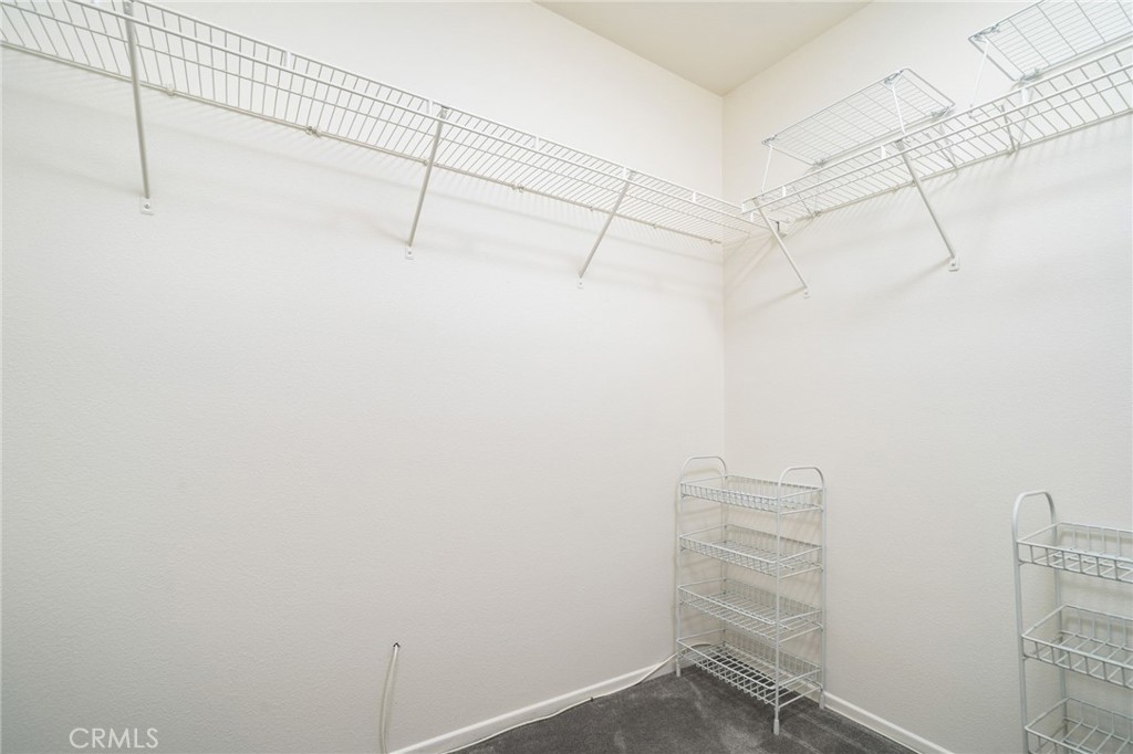 6361 Pintail Way Fontana, CA 92336 - Photo 18 of 32 a view of a room with racks on the wall