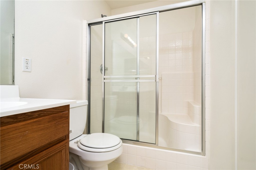 6361 Pintail Way Fontana, CA 92336 - Photo 20 of 32 a bathroom with a shower a toilet and a sink