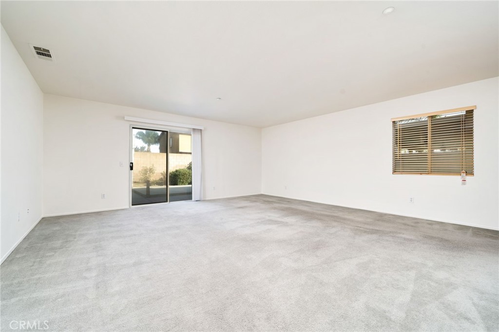 6361 Pintail Way Fontana, CA 92336 - Photo 6 of 32 an empty room with windows