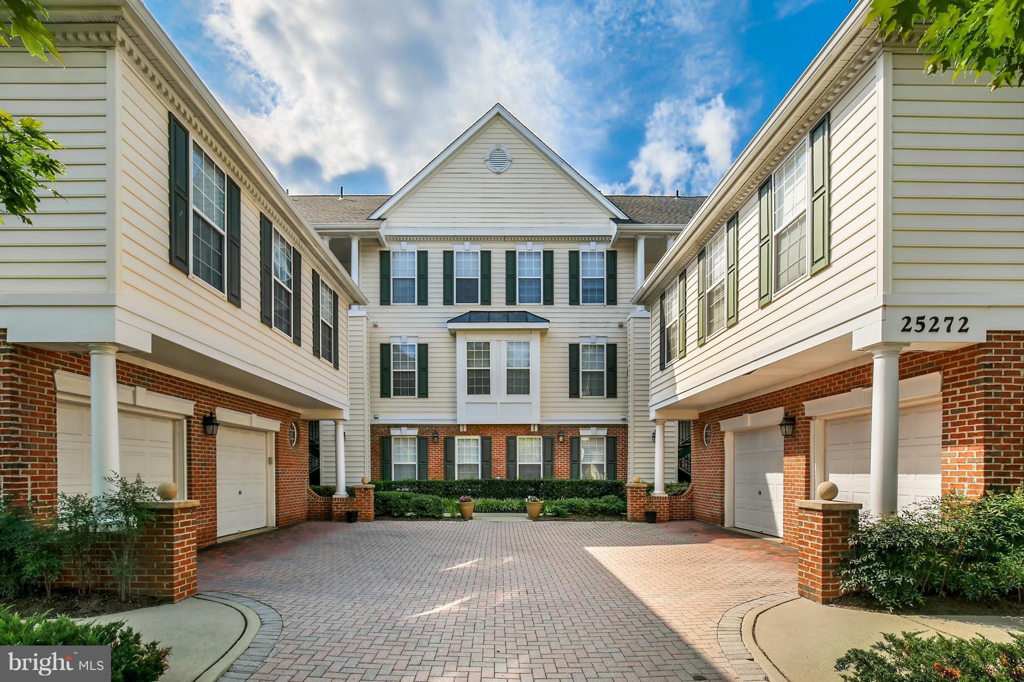25272 Riffleford Square, Unit 304 Chantilly, VA 20152 - Photo 1 of 30 a front view of a residential houses with yard