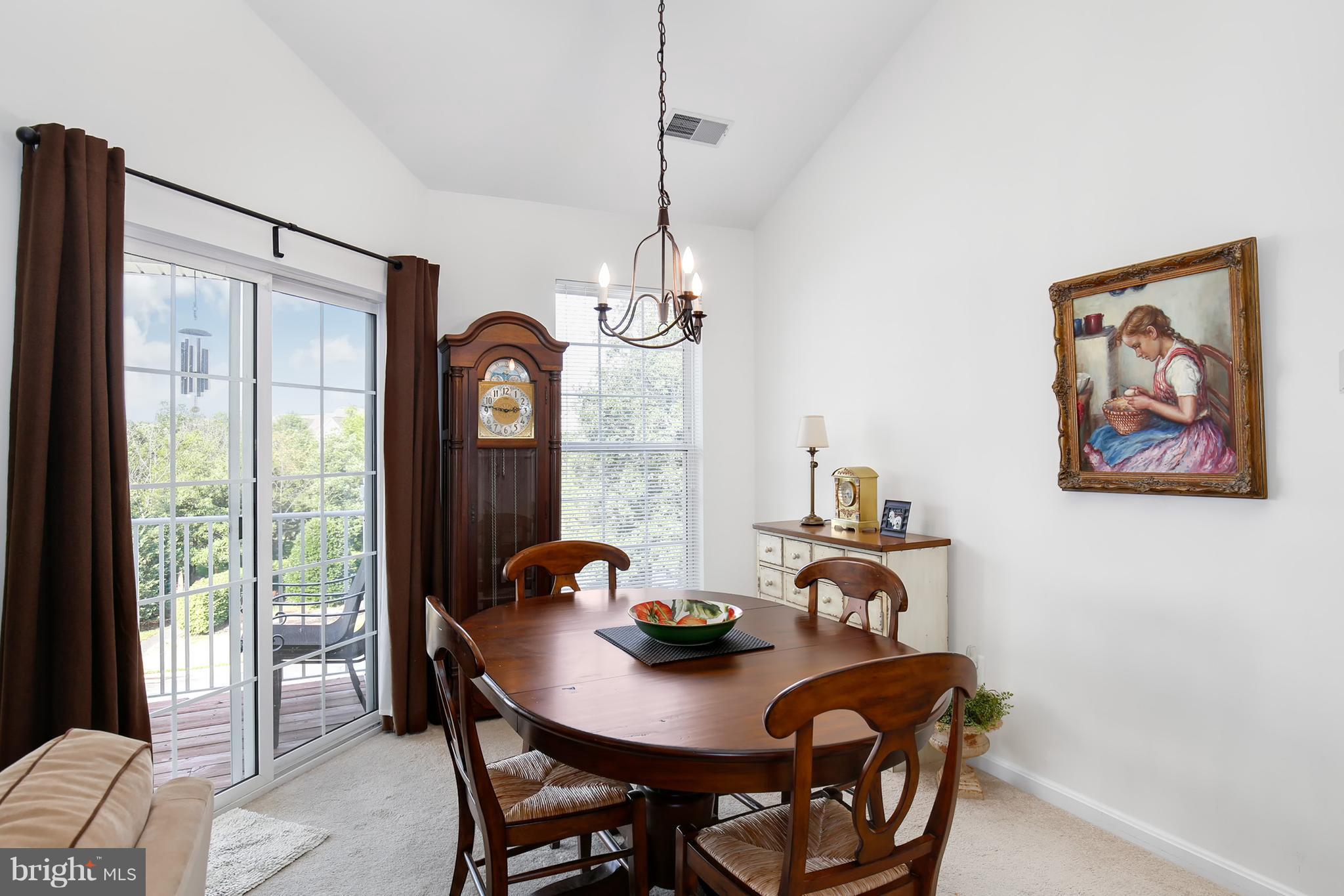 25272 Riffleford Square, Unit 304 Chantilly, VA 20152 - Photo 11 of 30 a view of a dining room with furniture window and outside view