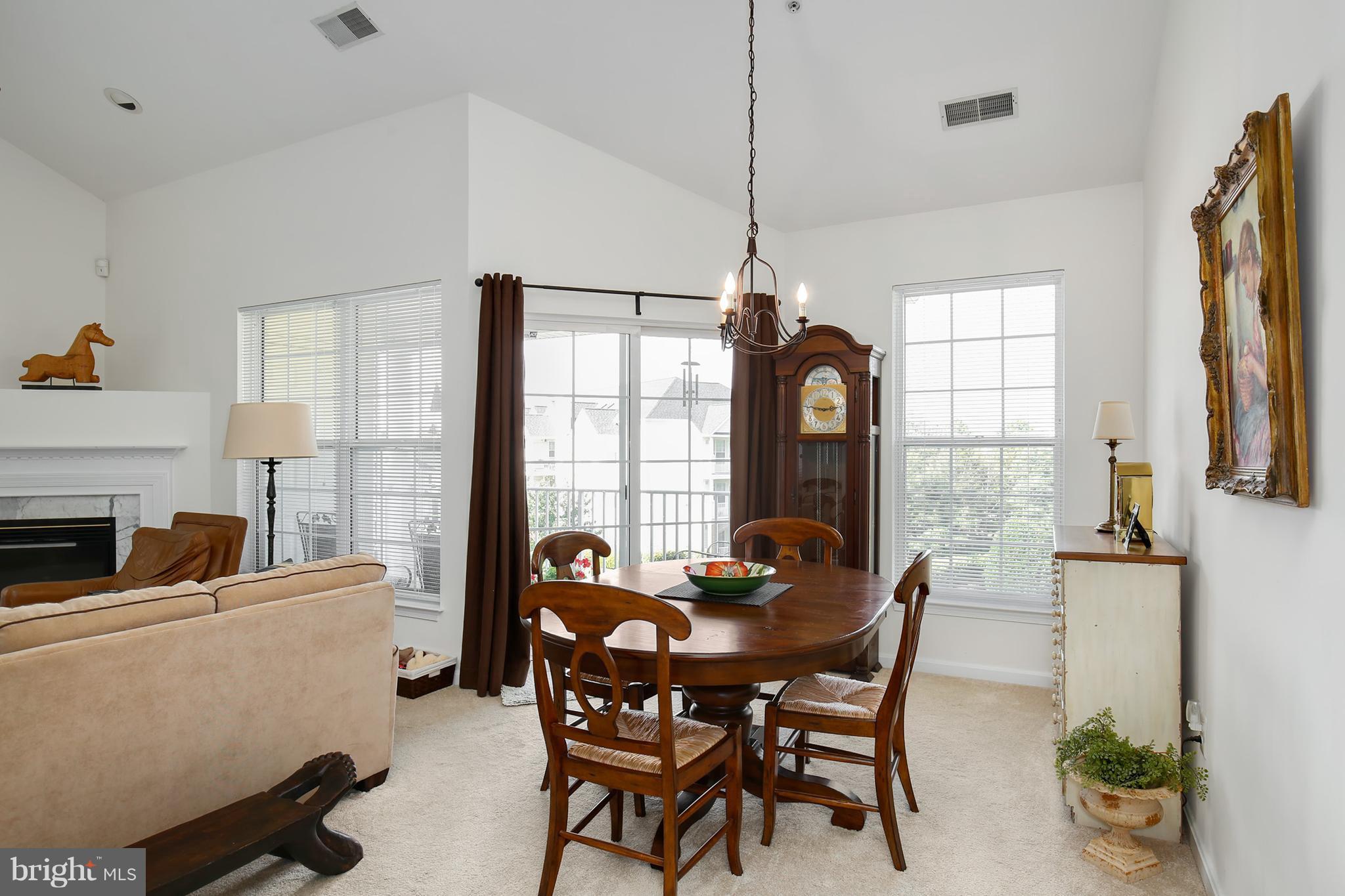 25272 Riffleford Square, Unit 304 Chantilly, VA 20152 - Photo 12 of 30 a dining room with furniture window and outside view