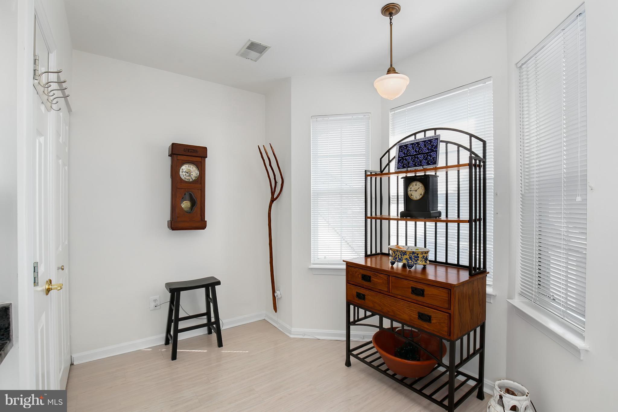 25272 Riffleford Square, Unit 304 Chantilly, VA 20152 - Photo 18 of 30 a bedroom with a bed and a chandelier