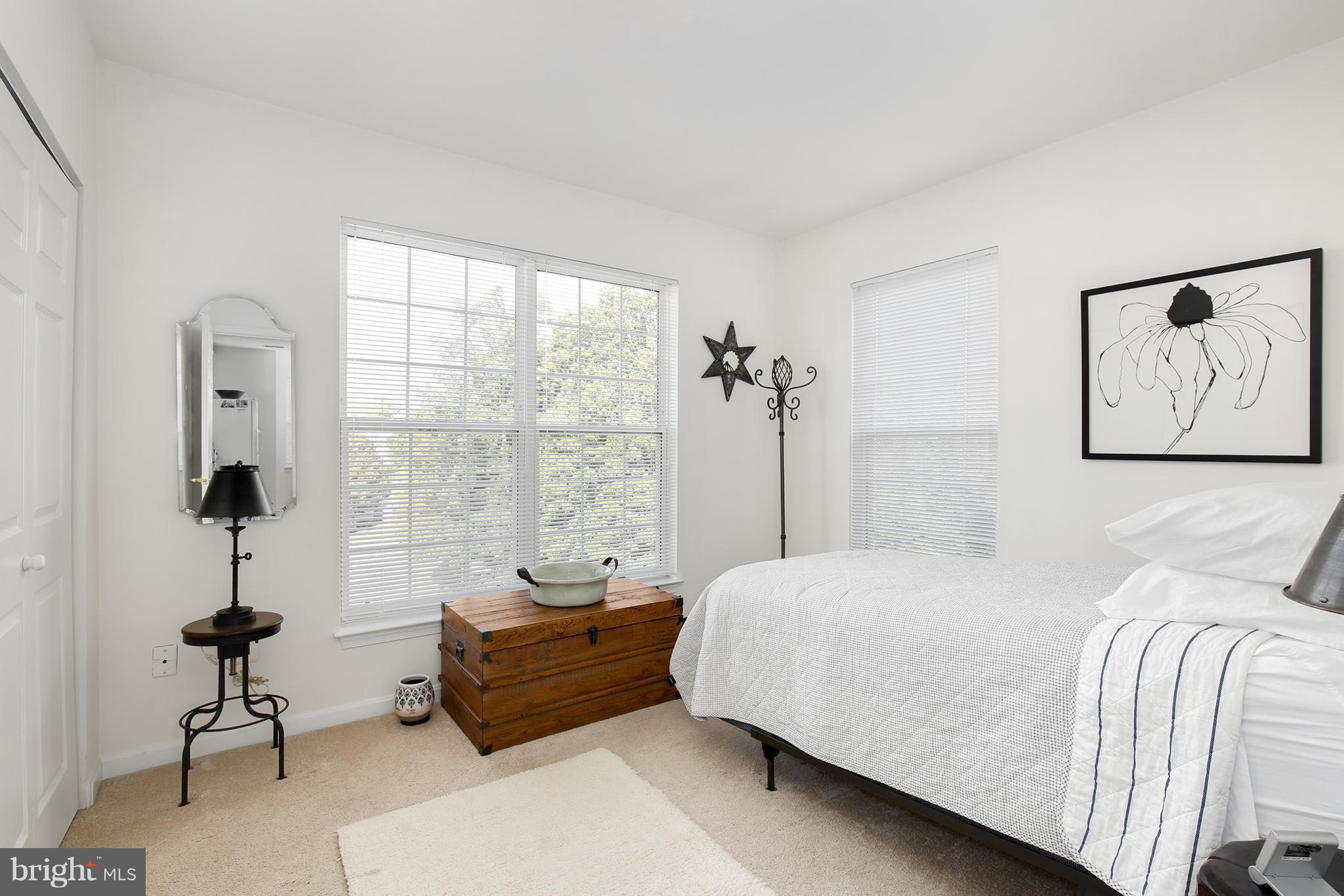 25272 Riffleford Square, Unit 304 Chantilly, VA 20152 - Photo 25 of 30 a bedroom with a bed and a window