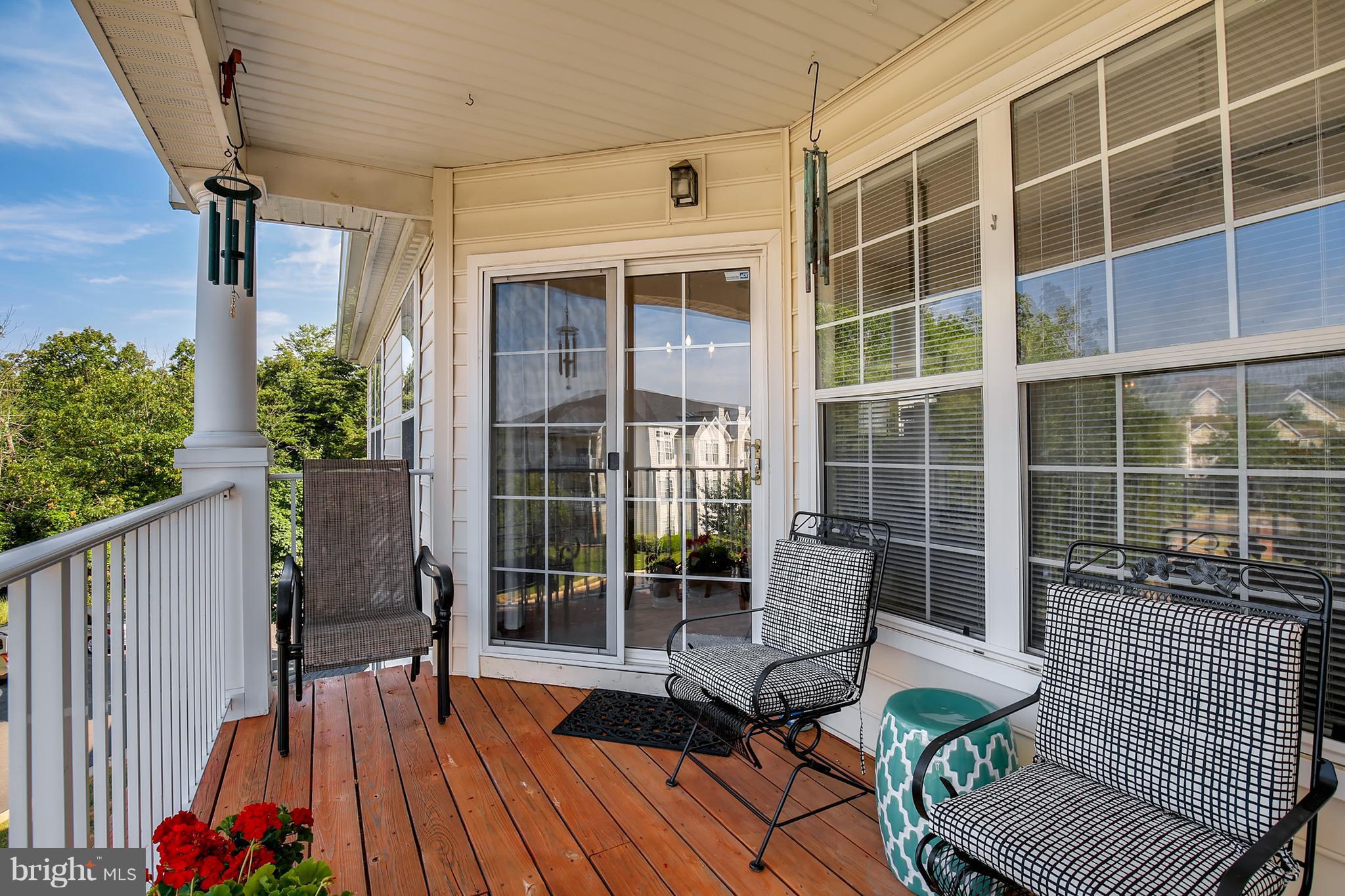 25272 Riffleford Square, Unit 304 Chantilly, VA 20152 - Photo 28 of 30 a view of balcony with wooden floor and seating space