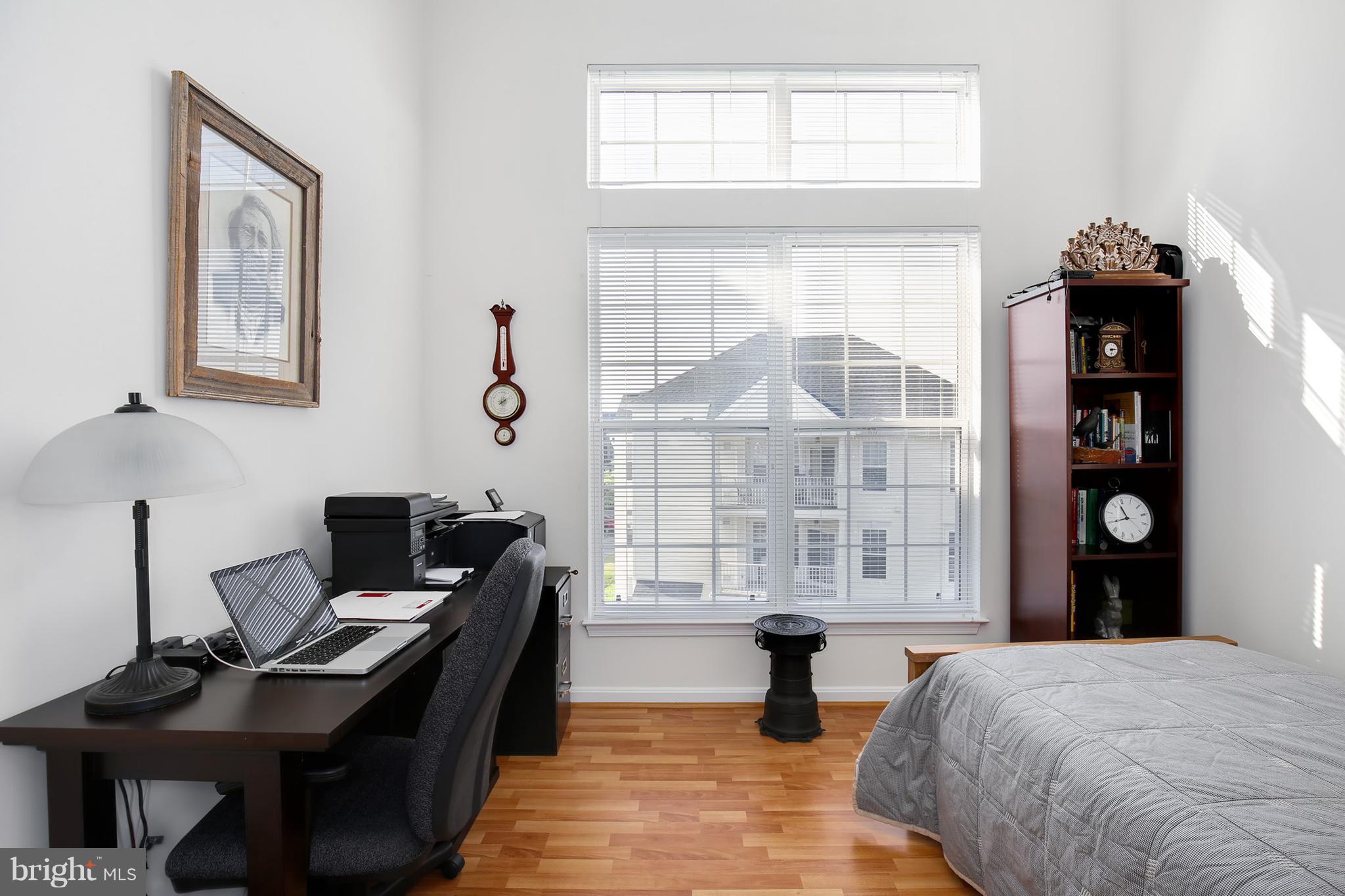 25272 Riffleford Square, Unit 304 Chantilly, VA 20152 - Photo 10 of 30 a bedroom with a bed and a window