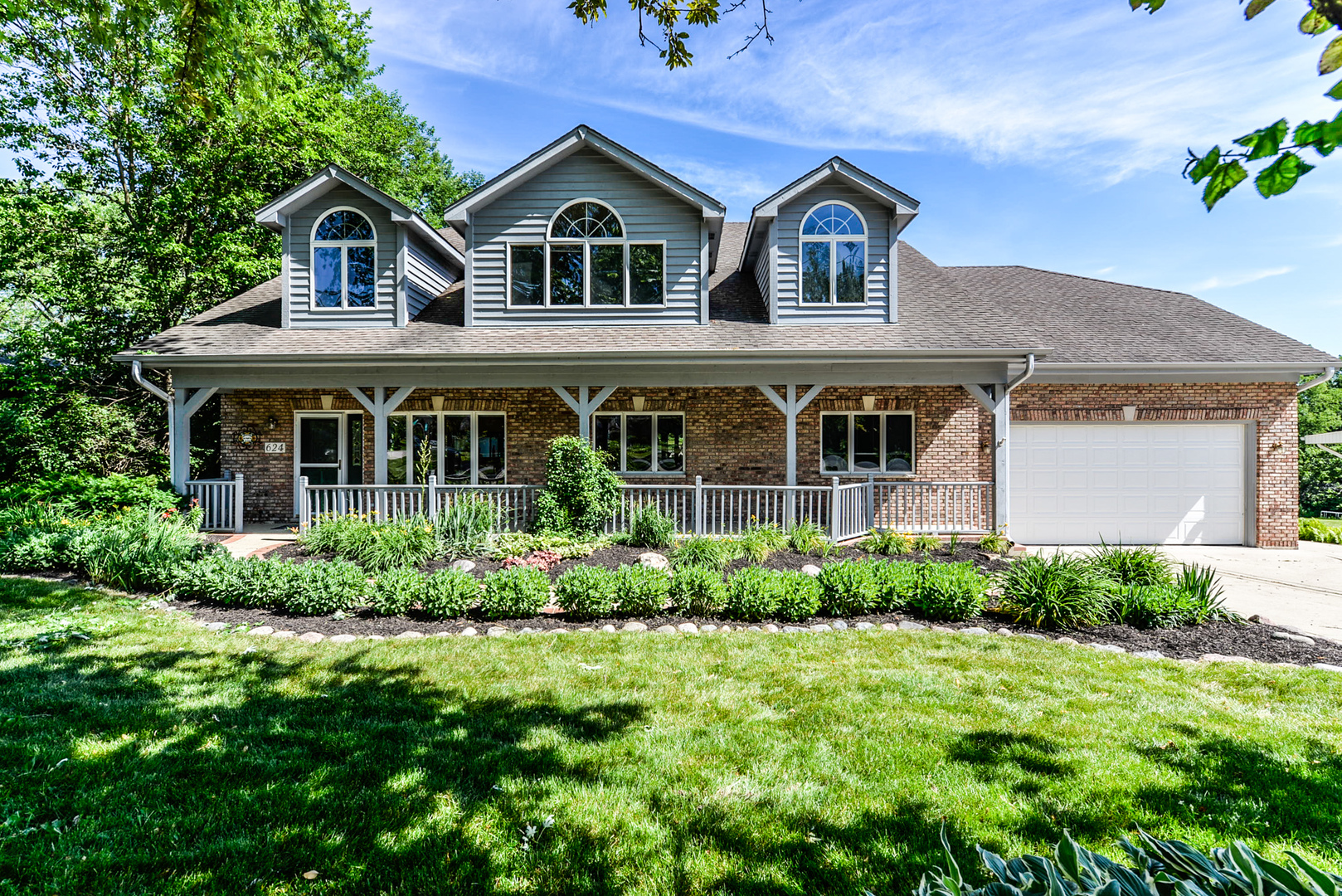 front view of a house with a yard