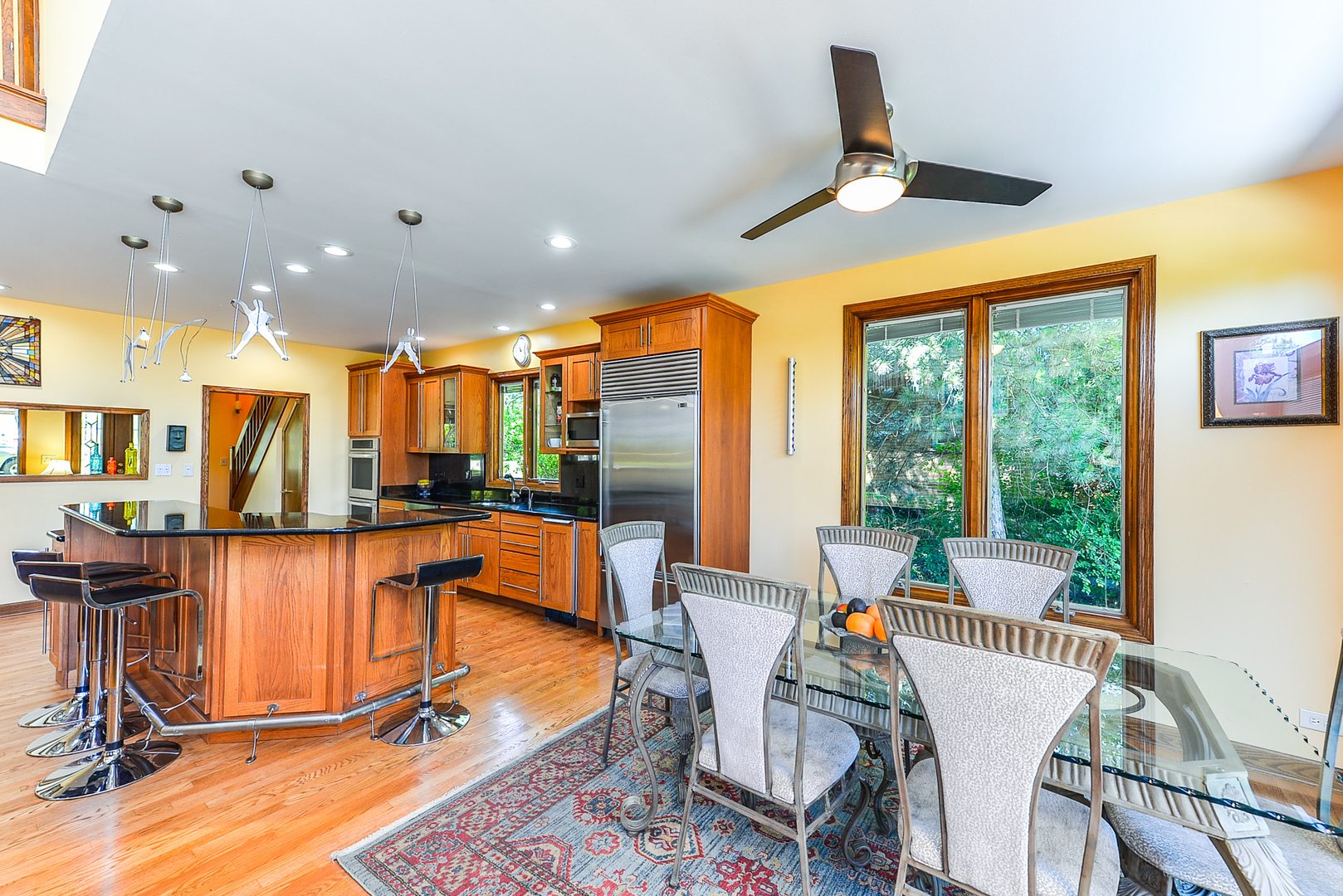 624 Riedy Road Lisle, IL 60532 - Photo 11 of 68 a dining room with furniture a chandelier and wooden floor