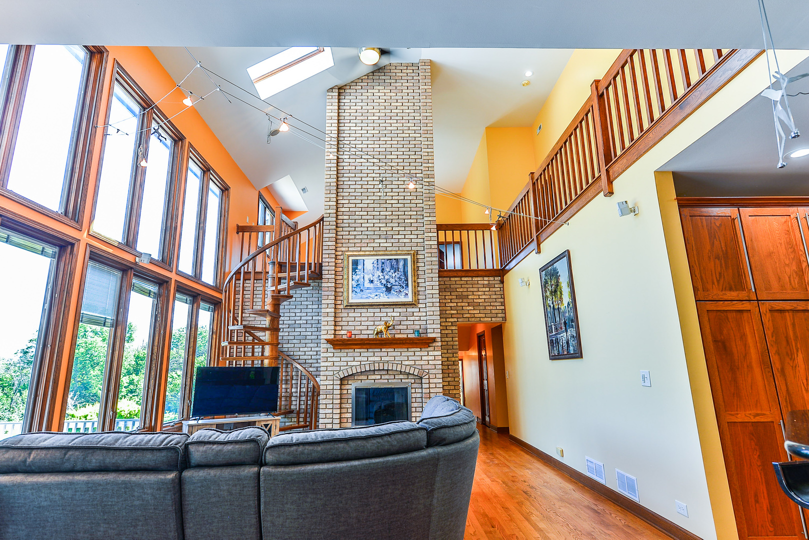 624 Riedy Road Lisle, IL 60532 - Photo 15 of 68 a view of living room kitchen with furniture and a fireplace
