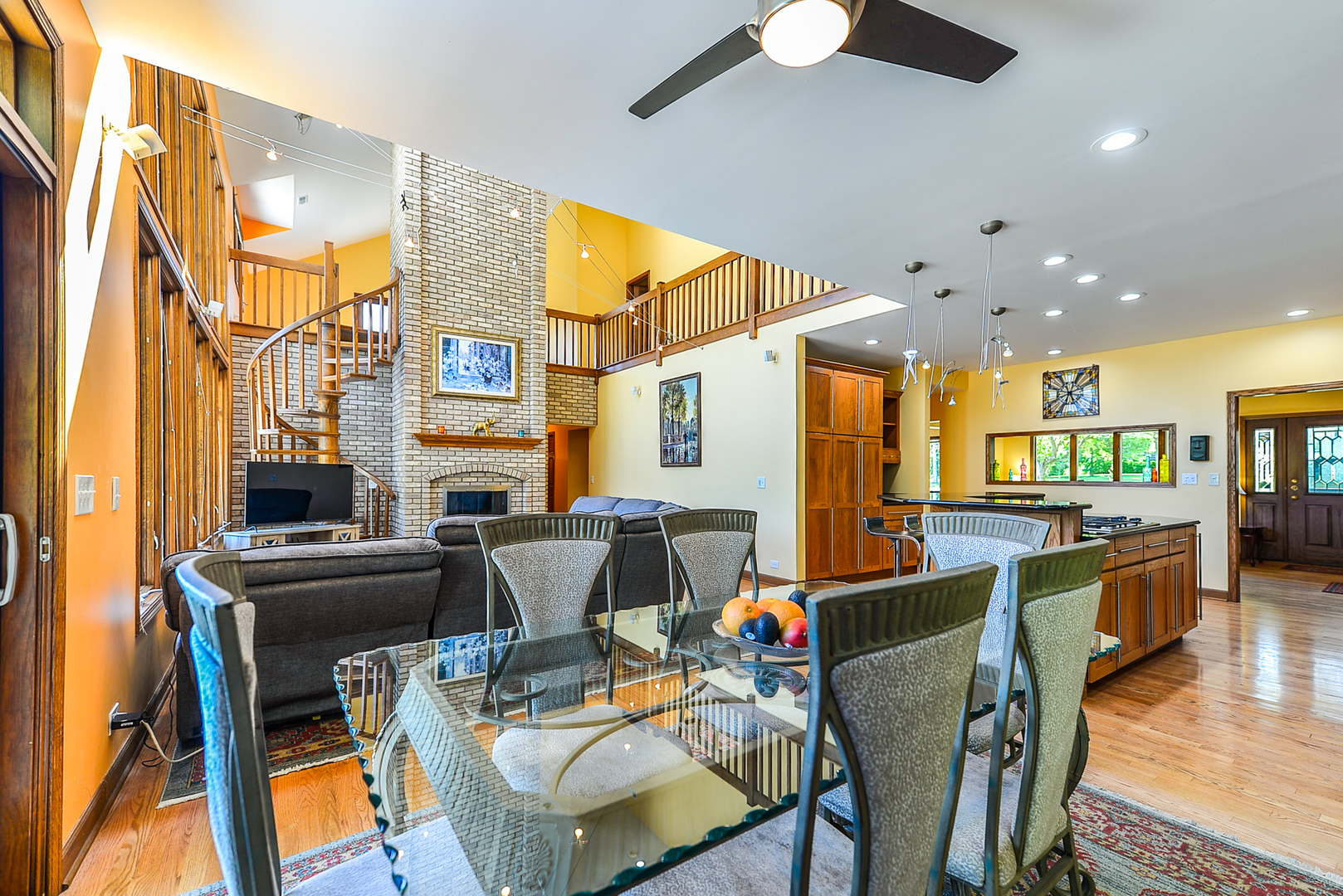 624 Riedy Road Lisle, IL 60532 - Photo 17 of 68 a view of a dining room with furniture a chandelier and wooden floor