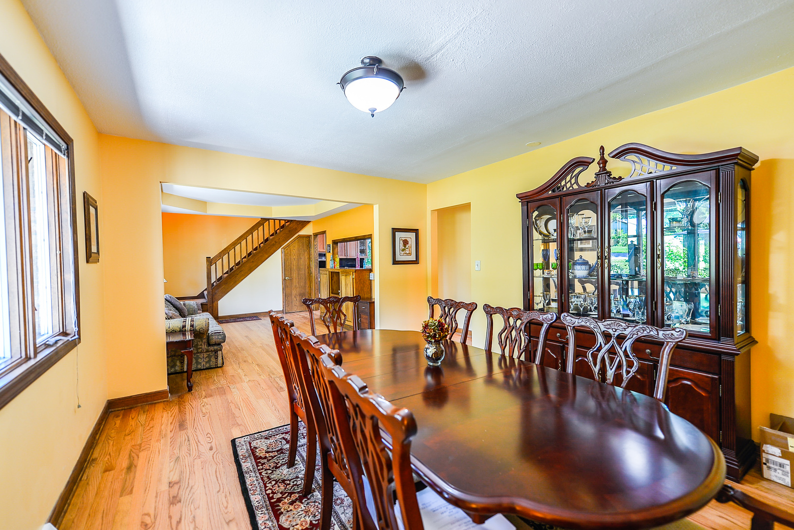 624 Riedy Road Lisle, IL 60532 - Photo 20 of 68 a view of a dining room with furniture wooden floor and chandelier