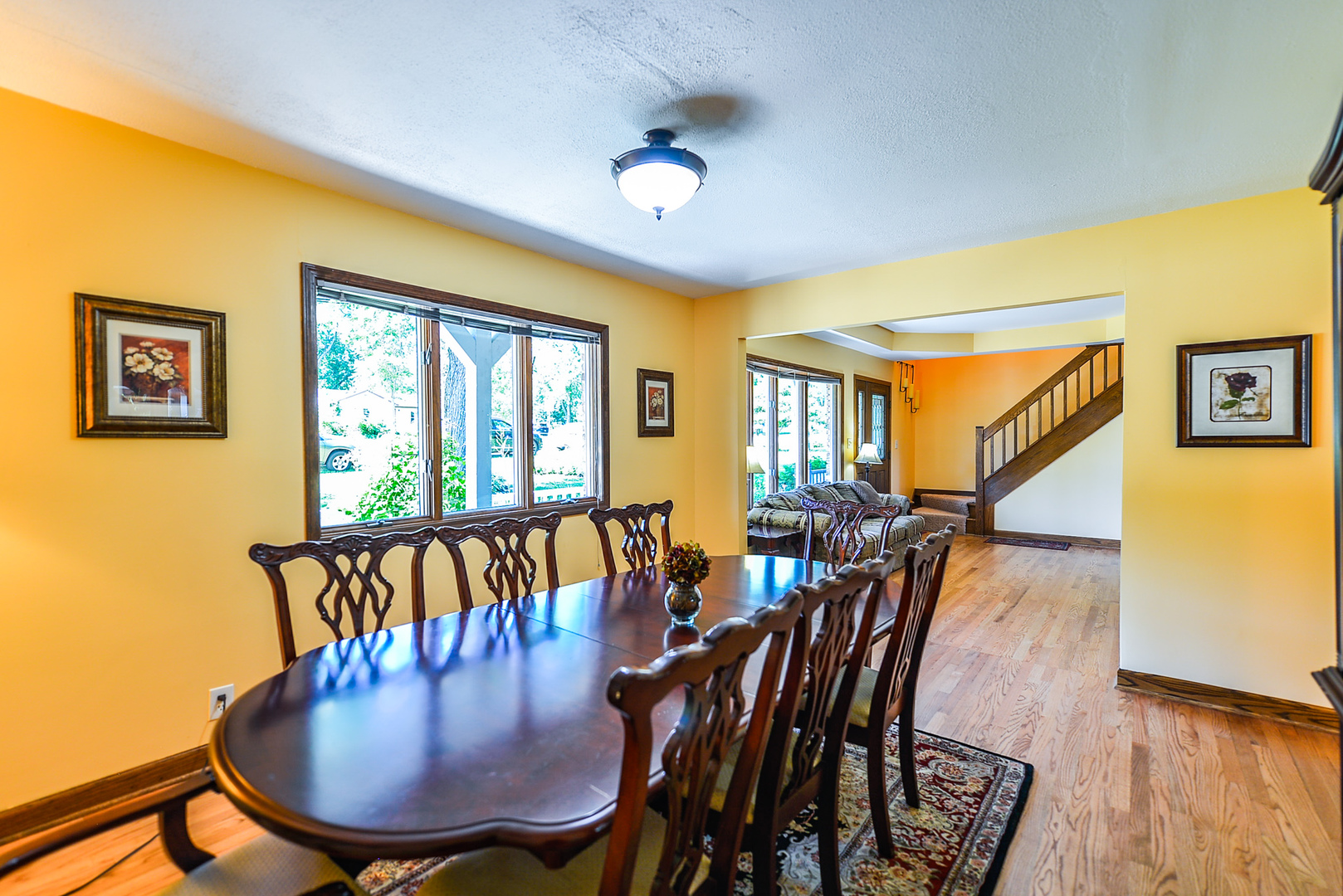 624 Riedy Road Lisle, IL 60532 - Photo 21 of 68 a dining room with furniture a rug and wooden floor