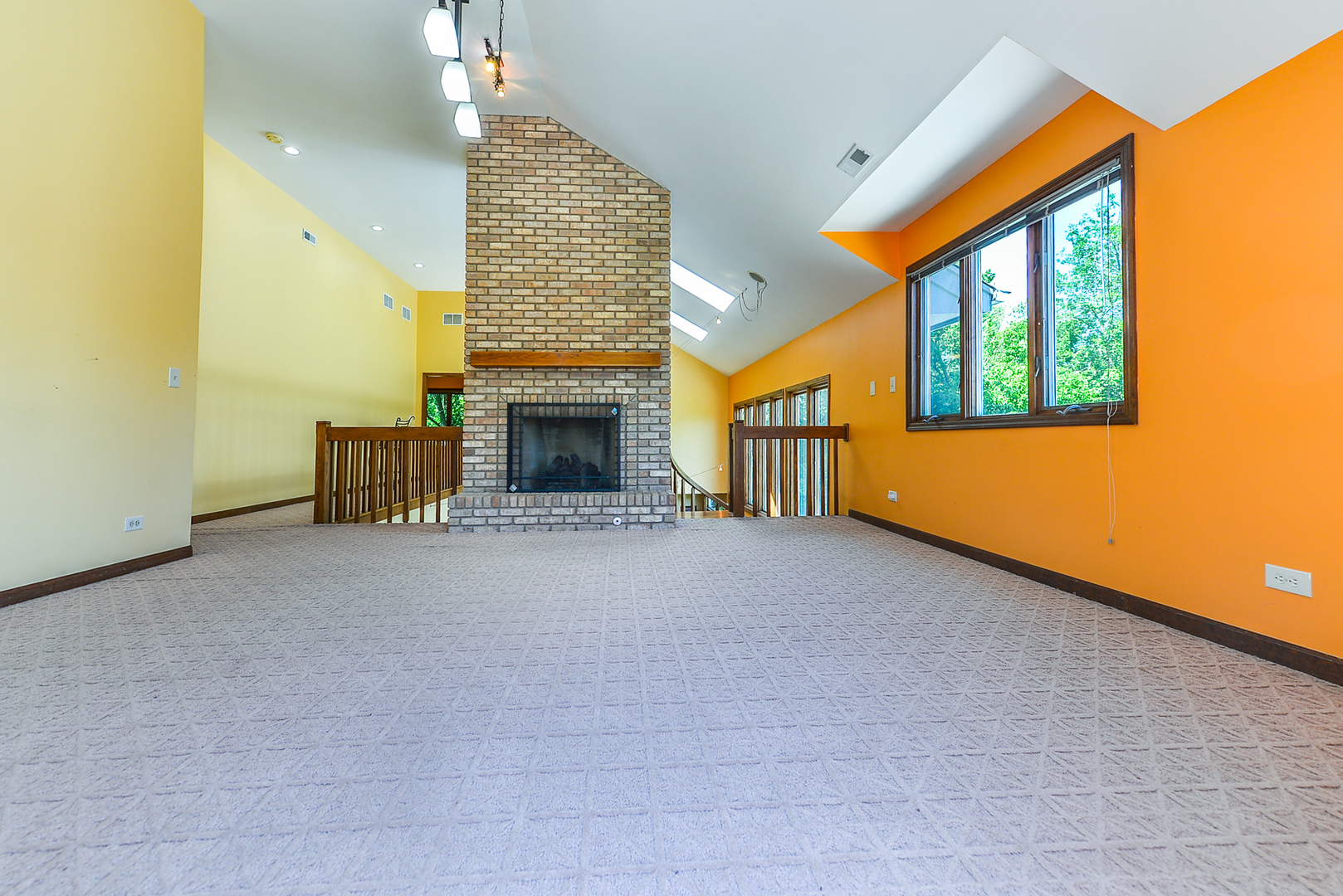 624 Riedy Road Lisle, IL 60532 - Photo 24 of 68 a view of an empty room with a fireplace and a window