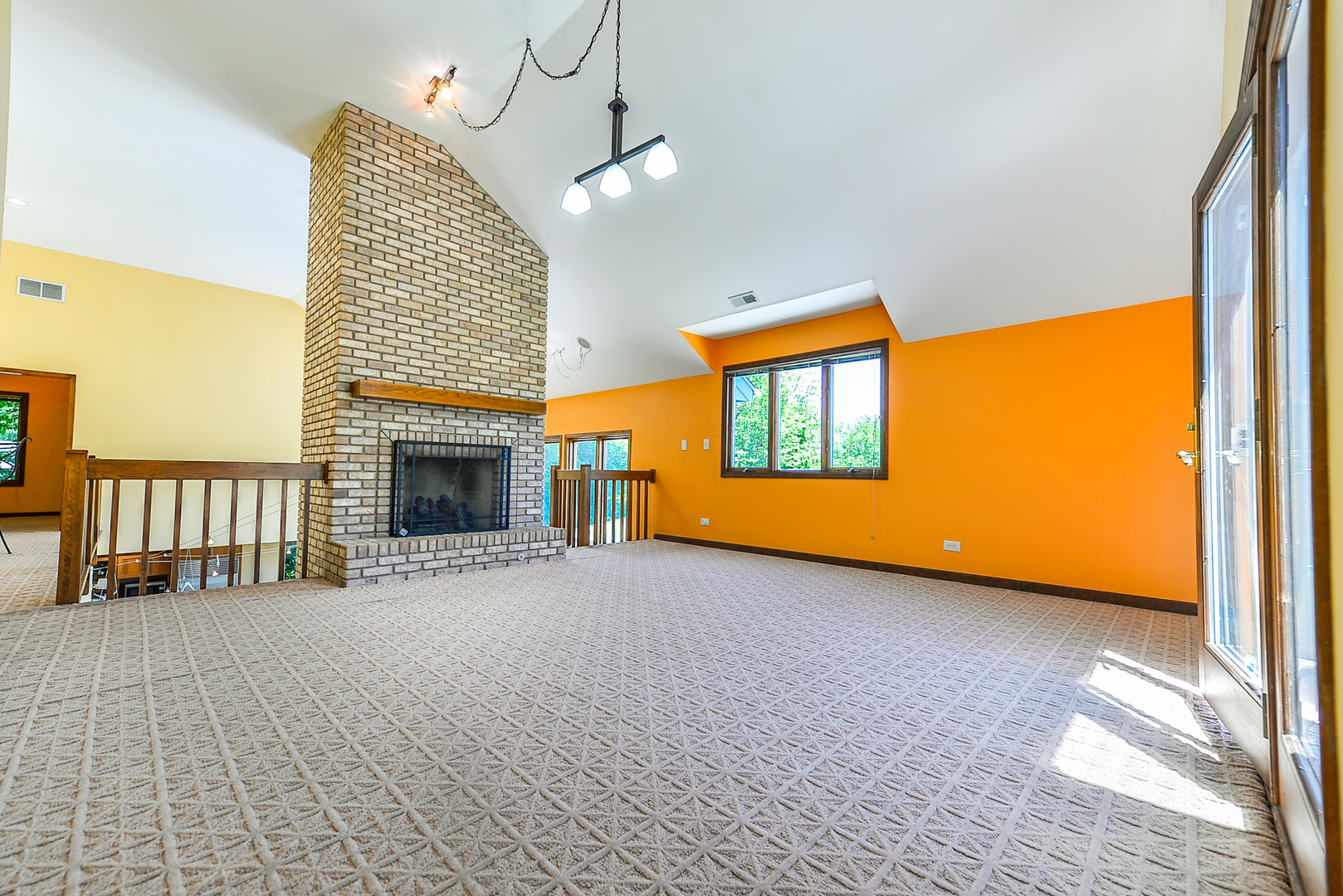 624 Riedy Road Lisle, IL 60532 - Photo 26 of 68 a view of an empty room with a window and a fireplace