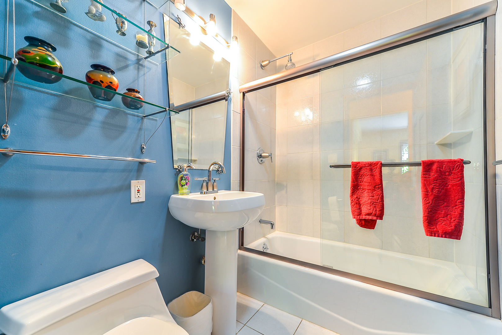624 Riedy Road Lisle, IL 60532 - Photo 45 of 68 a bathroom with a sink toilet and shower