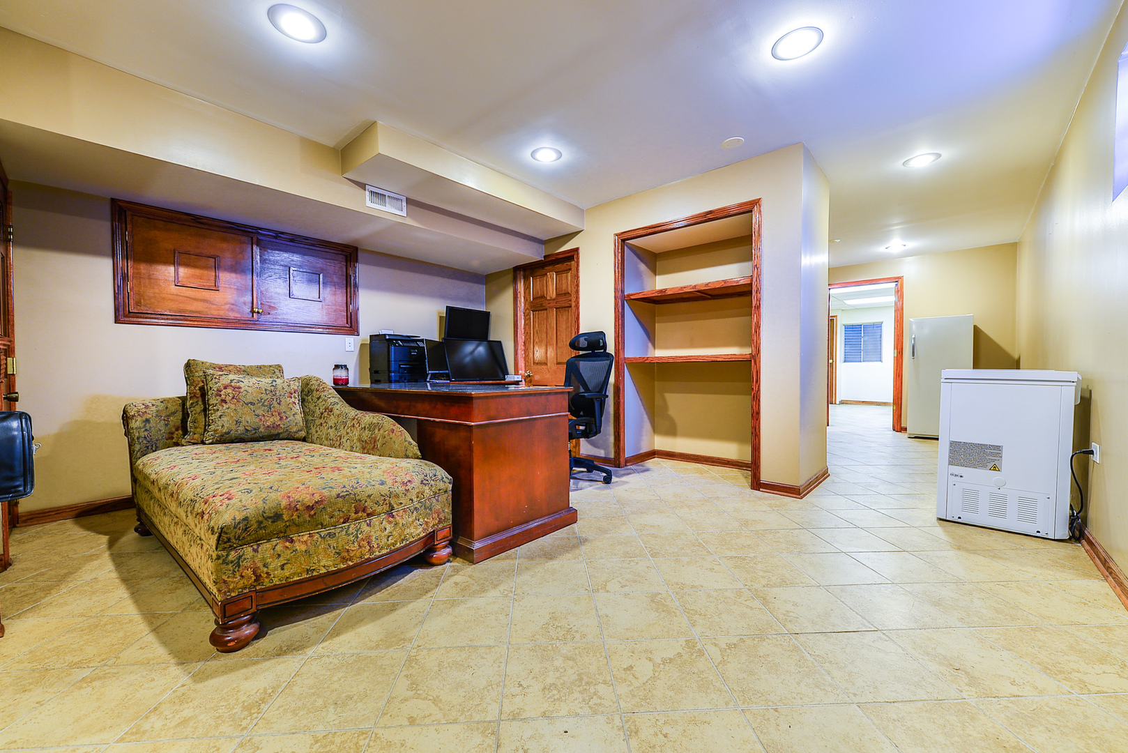 624 Riedy Road Lisle, IL 60532 - Photo 49 of 68 a living room with furniture and a refrigerator